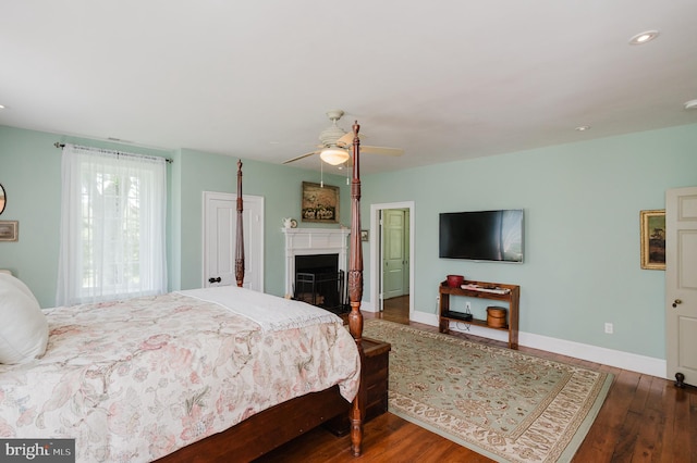 bedroom featuring hardwood / wood-style floors and ceiling fan