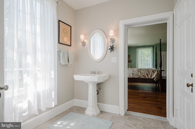 bathroom with tile flooring