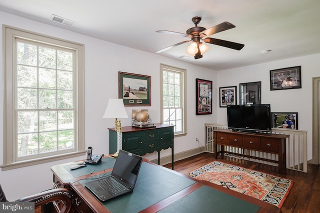 home office featuring dark wood-type flooring and ceiling fan