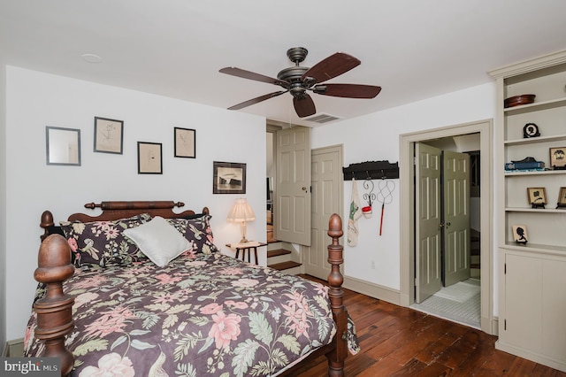 bedroom featuring dark tile floors and ceiling fan