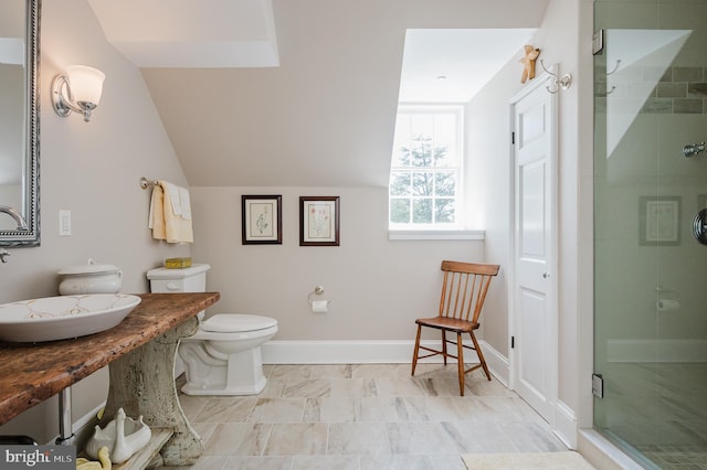 bathroom featuring tile floors, an enclosed shower, vanity, and toilet