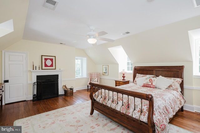 bedroom featuring vaulted ceiling, hardwood / wood-style floors, and ceiling fan