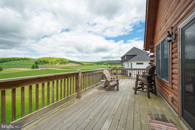 wooden deck featuring a yard