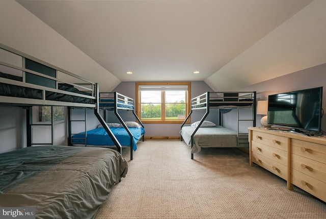 carpeted bedroom with lofted ceiling, baseboards, and recessed lighting