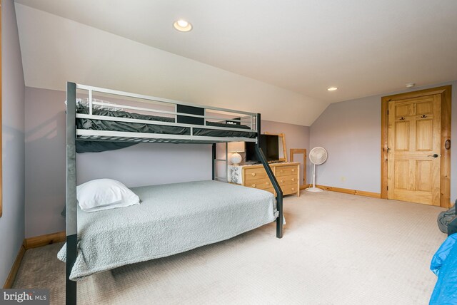 carpeted bedroom with recessed lighting, vaulted ceiling, and baseboards