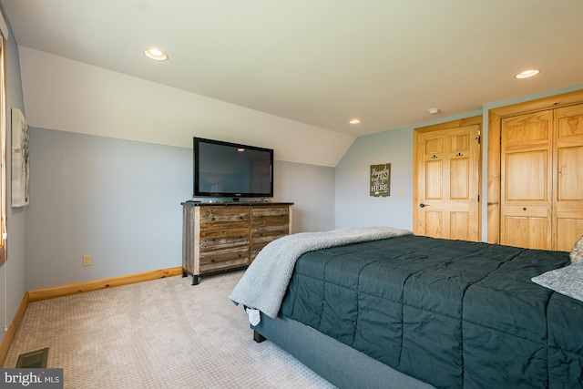 carpeted bedroom featuring vaulted ceiling