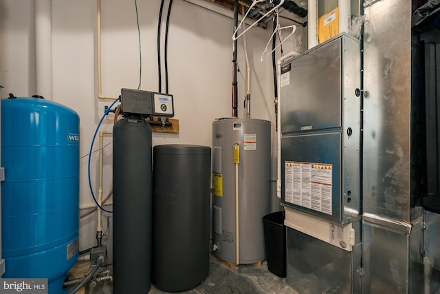 utility room with heating unit and electric water heater