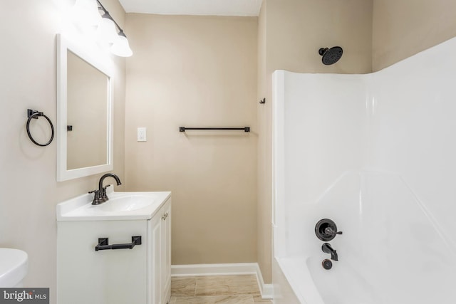 full bathroom with tile flooring, washtub / shower combination, vanity, and toilet