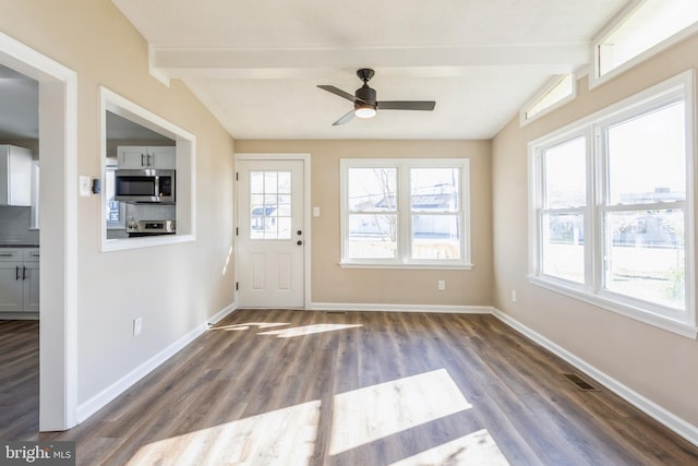 doorway featuring vaulted ceiling with beams, hardwood / wood-style floors, and ceiling fan