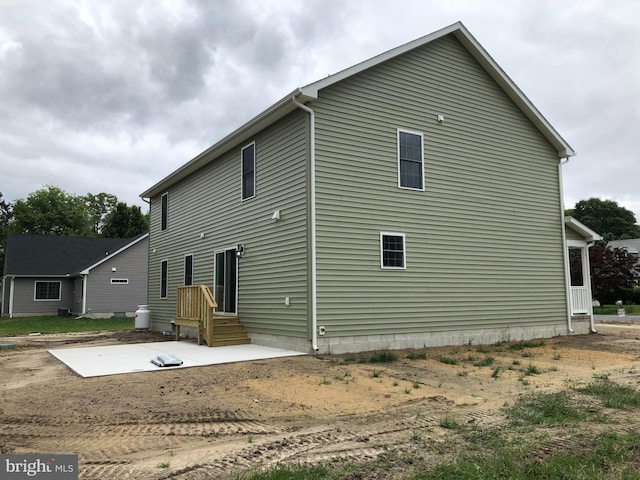 back of property featuring a patio