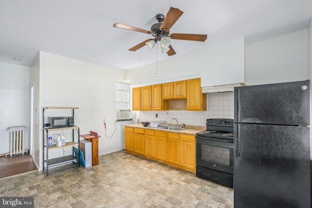 kitchen with ceiling fan, tasteful backsplash, black appliances, light tile floors, and radiator heating unit