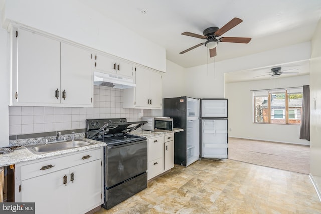 kitchen featuring ceiling fan, light tile flooring, black electric range, backsplash, and sink