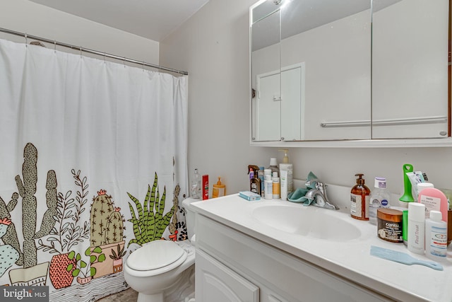 bathroom with oversized vanity and toilet