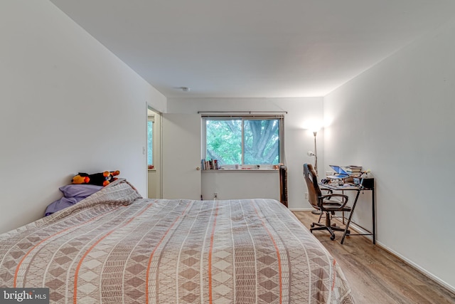 bedroom with light hardwood / wood-style flooring