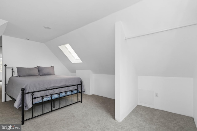 carpeted bedroom featuring lofted ceiling