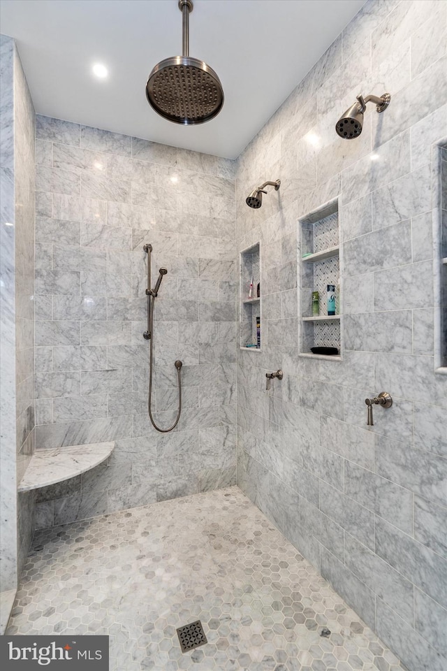 bathroom with a tile shower