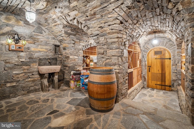 wine area with vaulted ceiling