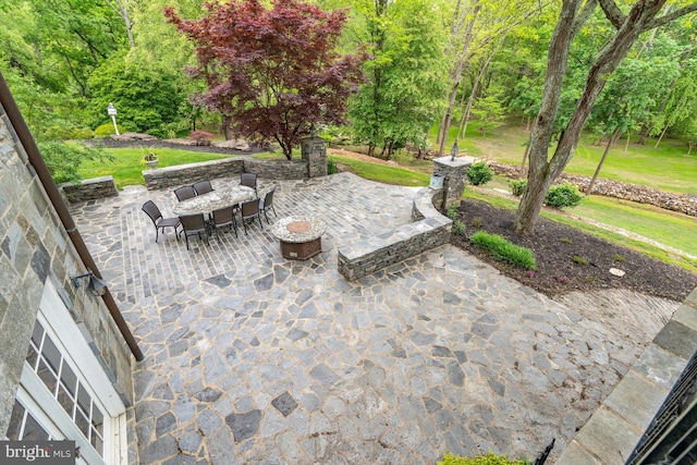 view of patio featuring an outdoor fire pit