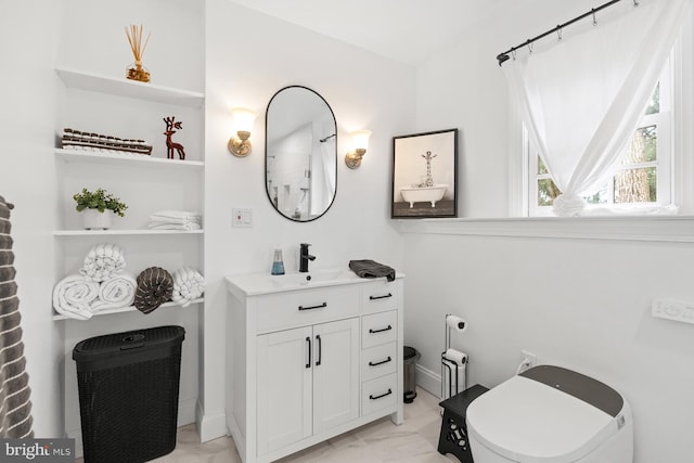 bathroom with vanity and toilet