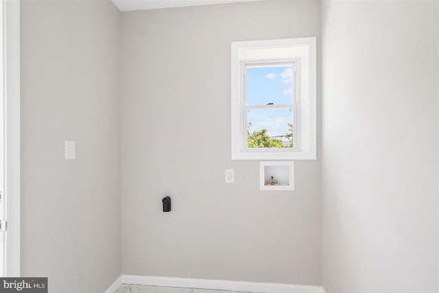 washroom featuring washer hookup and tile patterned floors