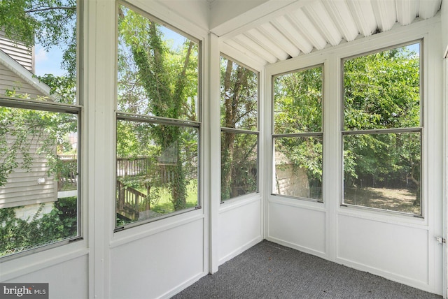 unfurnished sunroom featuring a wealth of natural light