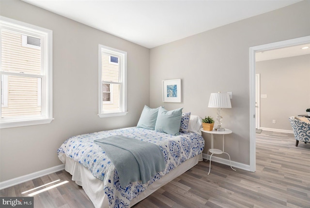 bedroom with wood-type flooring