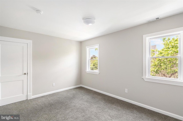 unfurnished room featuring carpet flooring