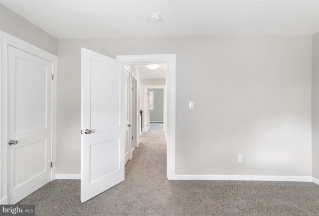 hallway featuring carpet