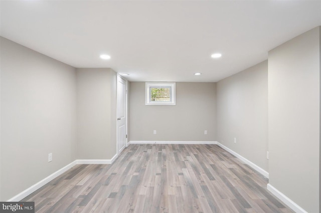 basement featuring light hardwood / wood-style flooring