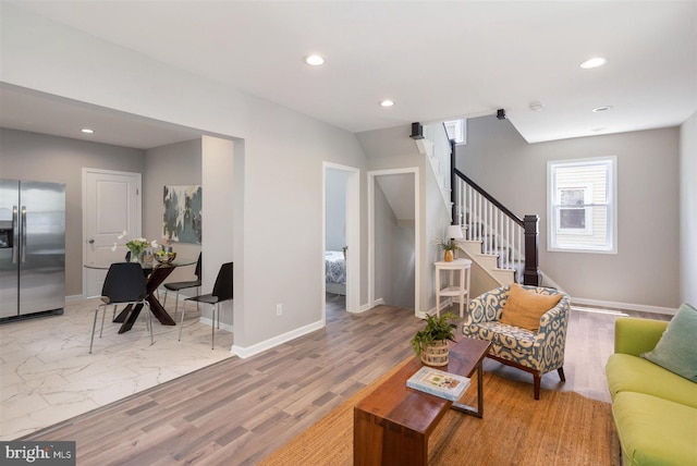 living room with light hardwood / wood-style floors