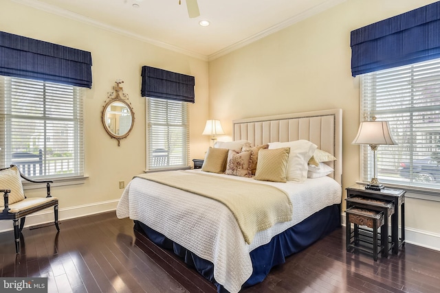 bedroom featuring ceiling fan, ornamental molding, and dark wood-type flooring