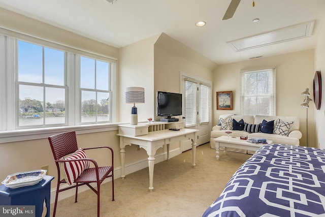 bedroom featuring light carpet and ceiling fan