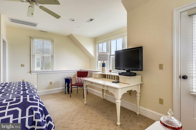 bedroom with ceiling fan, multiple windows, and carpet flooring