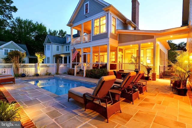 view of swimming pool featuring a patio