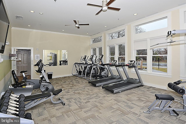 workout area featuring a high ceiling, carpet, ornamental molding, and ceiling fan