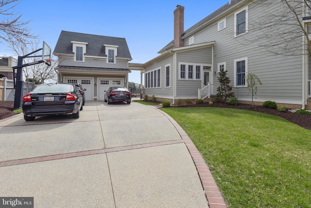 view of front of home with a garage and a front yard