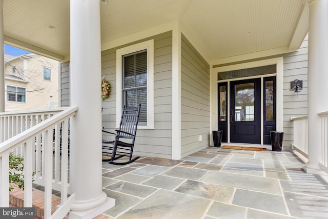 property entrance featuring covered porch