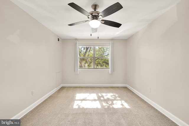 carpeted empty room with ceiling fan