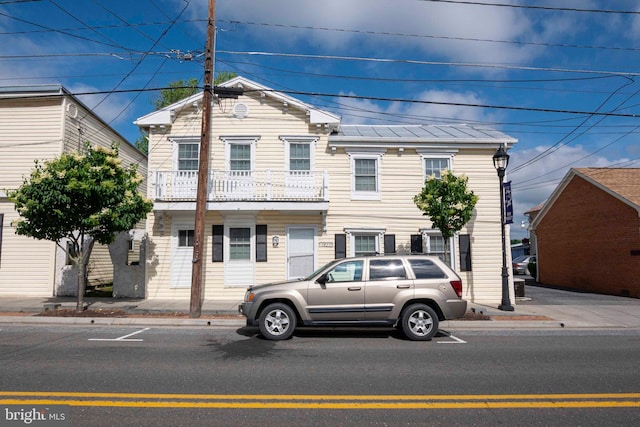 view of front of property with a balcony