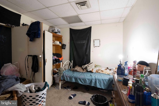 bedroom featuring a drop ceiling