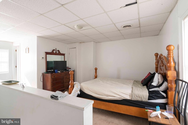 bedroom featuring a drop ceiling