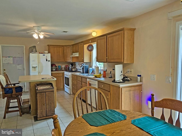 kitchen with white appliances, light tile patterned floors, and ceiling fan