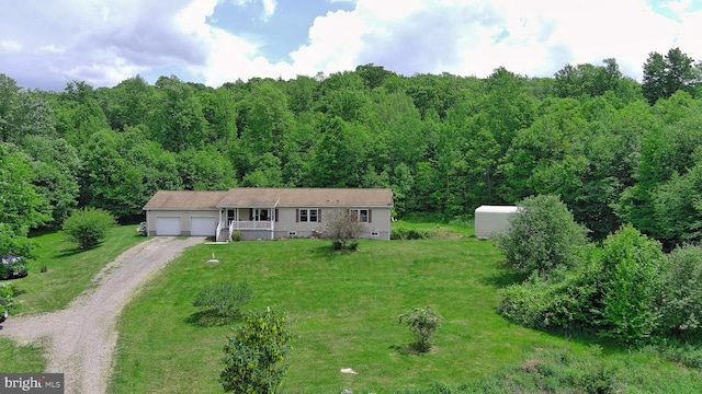 ranch-style house featuring a porch and a front lawn