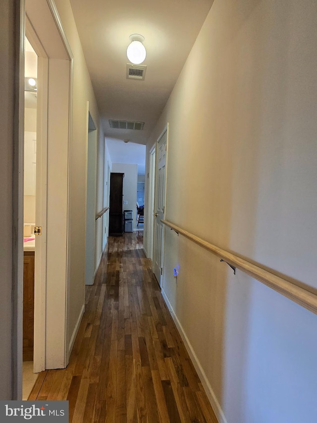 hallway with wood-type flooring