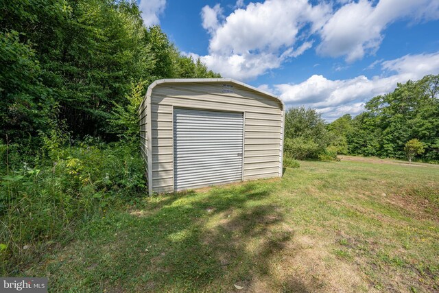 garage with a yard