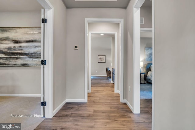 hallway featuring light hardwood / wood-style flooring