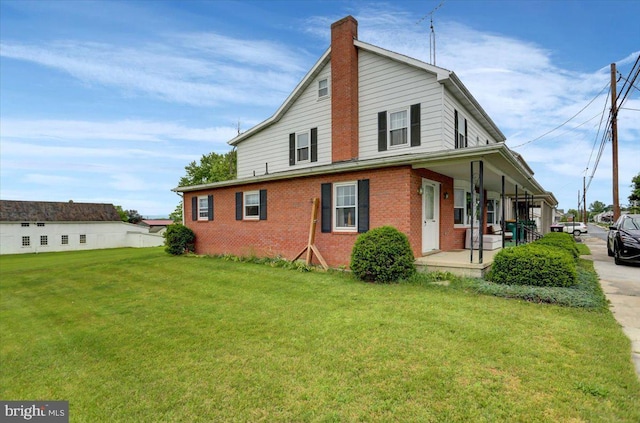 exterior space with a yard and a porch