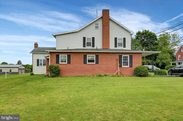 back of property featuring a yard