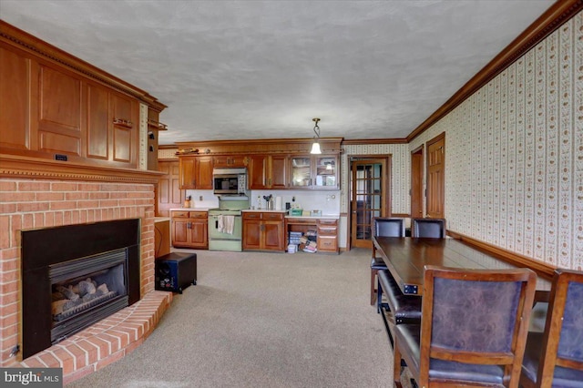 living room featuring a fireplace, light carpet, and ornamental molding