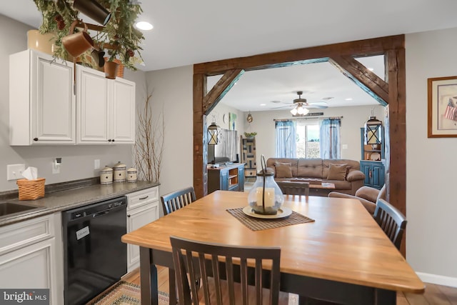 dining space featuring ceiling fan and hardwood / wood-style floors